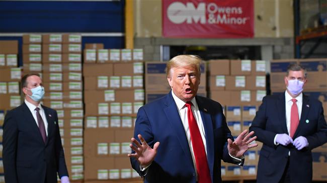 Without wearing a mask, Trump tours Pennsylvania mask distribution center