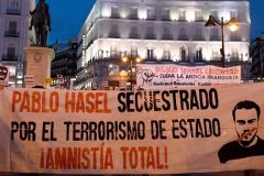 Violence erupts in Barcelona as protests over arrest of rap singer continue across Spain