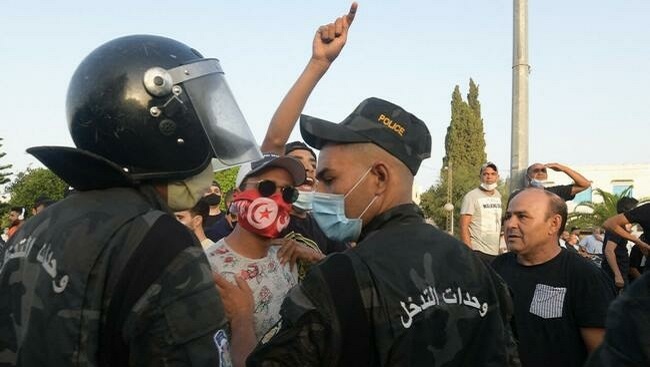 Clashes erupt outside parliament after Tunisian president ousts PM, suspends legislature