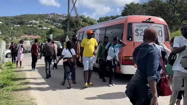 How did more than 600 Cameroonians come to find themselves stranded on a Caribbean island that many of them had never heard of?