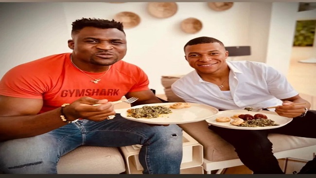 Francis Ngannou shares photos of himself and Kylian Mpabbe eating ndole
