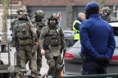 Belgium: police hunt for gunmen after Brussels shooting